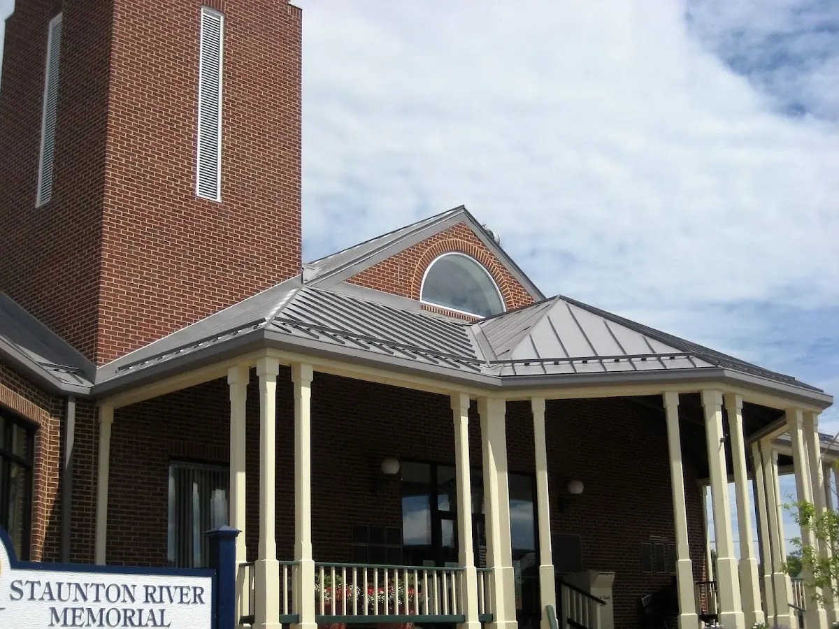 Skilled roofing craftsmen working on a residential roof in Logan